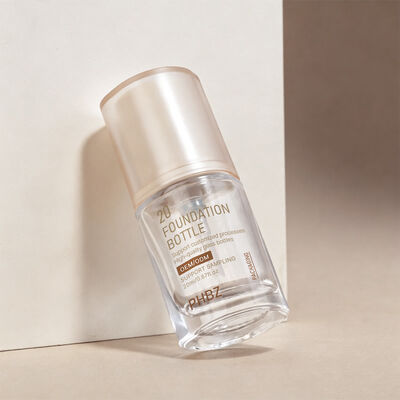 Liquid Foundation Botol kemasan kosmetik kaca yang dirancang untuk meningkatkan daya tarik rak dan kegunaan produk makeup cair