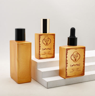 Minyak Kosmetik yang Disesuaikan 30ml 50ml 100ml Emas Kosong Persegi Mewah Botol Penetes Minyak Esensial Kaca
